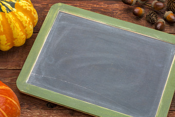 Canvas Print - blank slate blackboard against wood