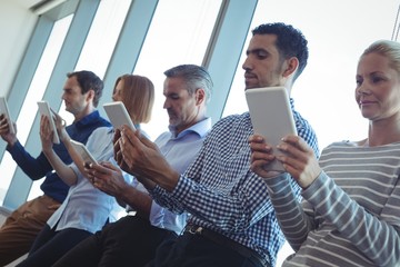 Wall Mural - Business people using digital tablets at office