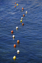 Buoys In The Blue Sea Of The Harbor