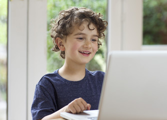 Young boy using a laptop