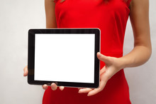 Young Woman In Red Dress Holding In Hands Tablet Computer With Blank Screen. Product Presentation. Special Offer. Market Research.