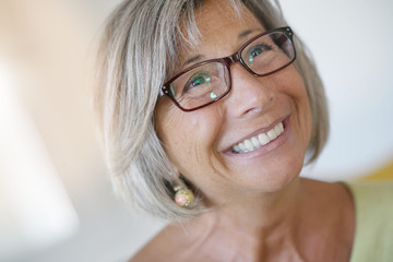 Portrait of smiling senior woman with eyeglasses