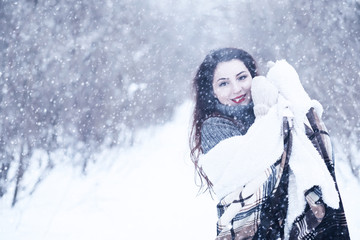 Beautiful girl in a beautiful winter snow