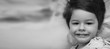 © alexkich - Black and white photo portrait of a young child lying on a pillow