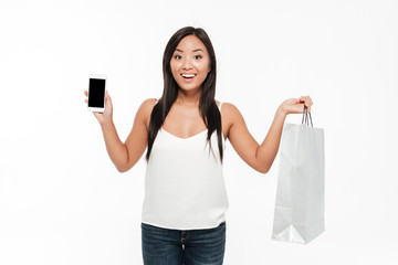 Wall Mural - Portrait of an excited smiling asian woman