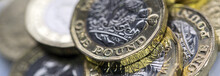 Selective Focus Of The New UK One Pound Coin In Panoramic Format