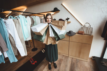 Wall Mural - happy woman with shopping bags