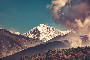 Wall Mural - Himalayas mountain landscape. Trekking in Nepal. Magnificent views of the mountain range peak in clouds. Picturesque and gorgeous scene. Holiday, travel, sport, recreation. Retro vintage toning effect