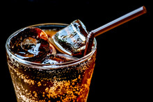 Cola With Ice,Food Background.Glass Of Cola With Ice Cubes On Black Background.Glasses Of Sweet Carbonated Drinks With Ice Cubes,Close Up.