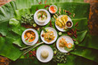 © Nabi Tang/Stocksy - Variety of authentic thai traditional meal set on green banana leaves