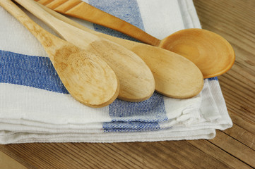 Wall Mural - wooden spoon and dishcloth on old wooden table