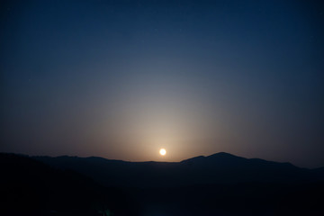 Wall Mural - moon rising on night sky