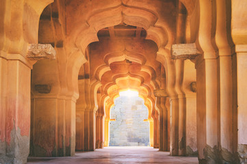 old ruined arch of lotus mahal at sunset, hampi, karnataka, india.