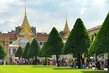 Tourists visit the Grand Palace in Bangkok, Thailand. Grand Palace is the most famous temple and landmark of Thailand and the home of the Thai King