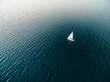 © Jen Grantham Photography/Stocksy - Aerial drone image of a sailboat sailing into sunset