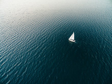 Aerial Drone Image Of A Sailboat Sailing Into Sunset