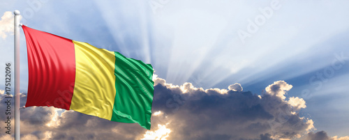 Cuadros en Lienzo Guinea flag on blue sky. 3d illustration