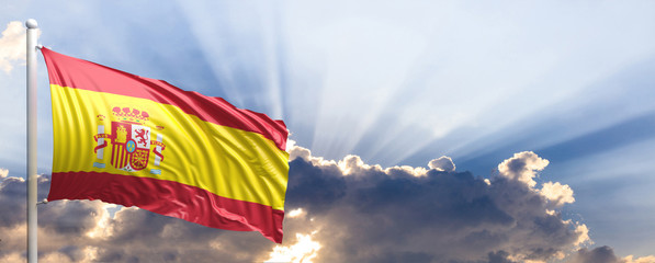 Wall Mural - Spain flag on blue sky. 3d illustration