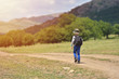 © Daniel CHETRONI - Cute child boy with backpack walking on a little path in mountains. Hiking kid