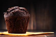 Chocolate Muffin On Wooden Table