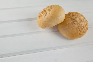 Two buns on wooden table