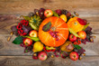 Thanksgiving arrangement with pumpkins, apples, pears, colorful leaves