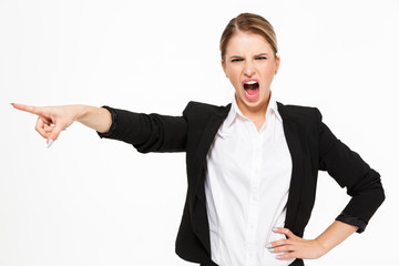 Poster - Angry screaming blonde business woman holding arm on hip