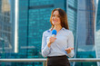 © Anton Gvozdikov - Young girl TV reporter is broadcasting on modern city background