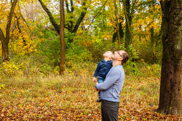 Wall Mural - Dad and son in the autumn park