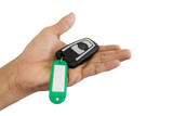 Fototapeta Nowy Jork - Hand holding key remote car and Key chain with blank text isolated on white background.