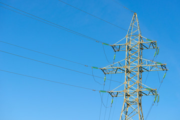 High voltage power pylons in the afternoon