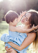 © bulashenko - Lovely portrait of a mother with her little daughter in the rays of the setting sun