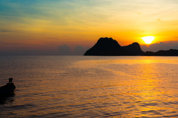 Wall Mural - Bright colors at dawn on the beach at sunrise in the Gulf of Thailand.