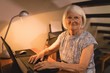 © Wavebreak Media - Senior woman working on laptop