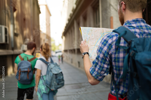 Fotografie, Tablou Tourist holding map and sightseeing in city