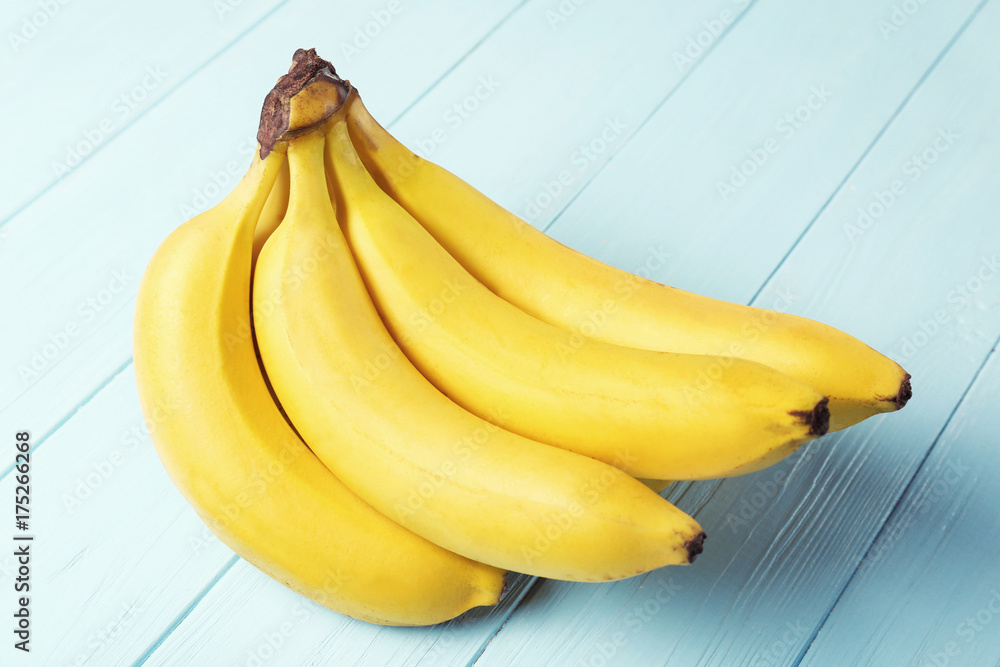 Yummy bananas on wooden background