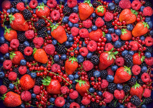 berries overhead closeup colorful large assorted mix of strawbwerry, blueberry, raspberry, blackberr