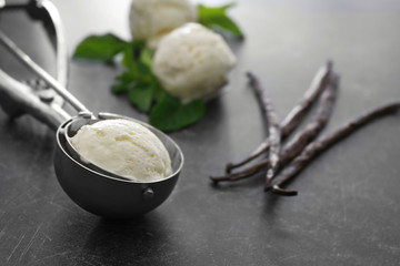 Poster - Scoop with vanilla ice cream on grey background