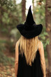 © Javier Pardina/Stocksy - blonde girl in a witch costume