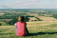 Rear View Of Boy Enjoying View In Oxfordshire