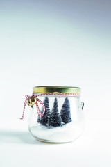 Wall Mural - Small Christmas trees in a glass jar