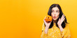 © Tierney - Young woman holding a pumpkin in halloween theme