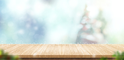 Aufkleber - Empty wooden table with abstract blur christmas tree and snow falling background with bokeh,Holiday backdrop,Mock up banner for display of product for promotion online