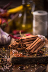 Wall Mural - Whole cinnamon stocks on wooden boar. Spices concept