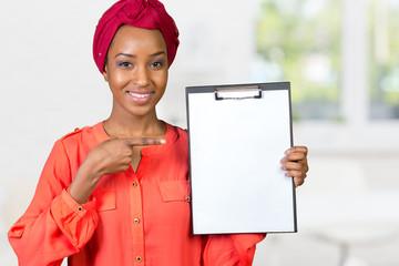 African american woman holding blank paper