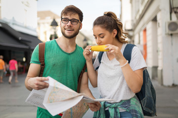 Wall Mural - Young travelling people having fun in city