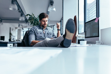 Wall Mural - Businessman relaxing in office during break