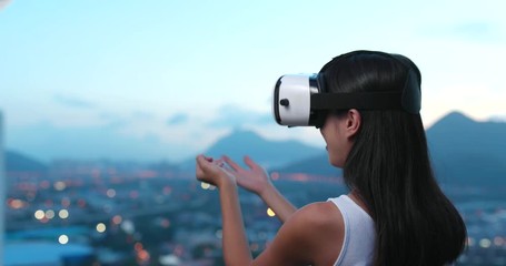 Wall Mural - Woman watching with VR device