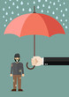 Hand holding an umbrella protecting poor man