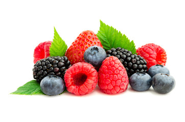 Close-up arrangement with mixed, assorted berries including blackberries, strawberry, blueberry and raspberries and fresh leaf isolated on white. Colorful, healthy concept. Black, blue, red, green